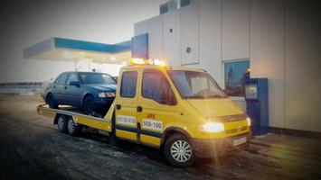 эвакуатор везет авто